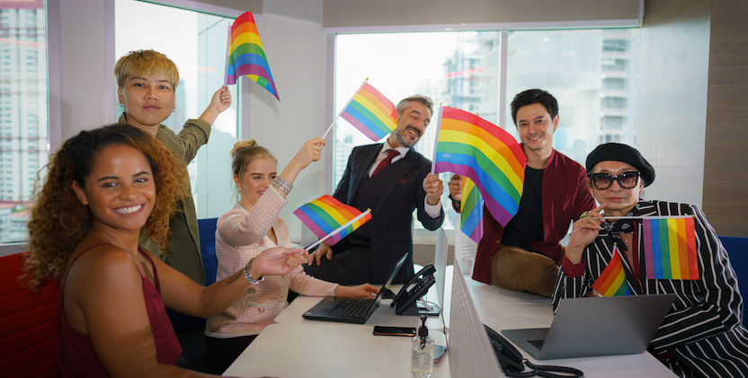 LGBTIQ people in office waving flags
