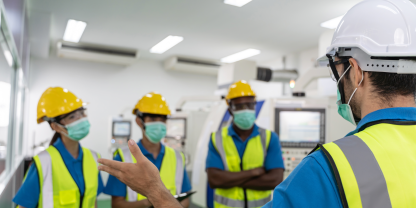 Worker providing instructions for colleagues at work site