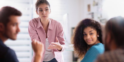 Diverse people having discussion in meeting room