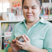 Women with vision impairment holding smartphone