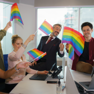 LGBTIQ people in office waving flags